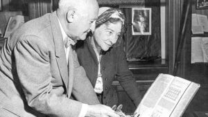 William Friedman and Elizabeth Smith Friedman examining book in their study during World War I.